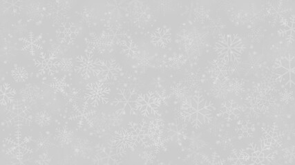 Christmas background of snowflakes of different shapes, sizes and transparency in gray and white colors