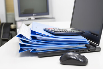 Blue Document folder with Notebook on table at office