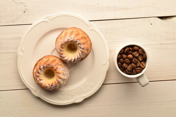 Fragrant sweet cupcakes, close-up, on a white wooden table.