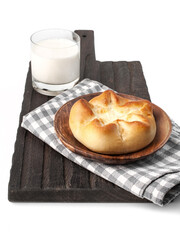 food photography of homemade sweet bun for breakfast with cottage cheese filling (cheesecake) side view. Baked bun made of yeast dough on white background close up