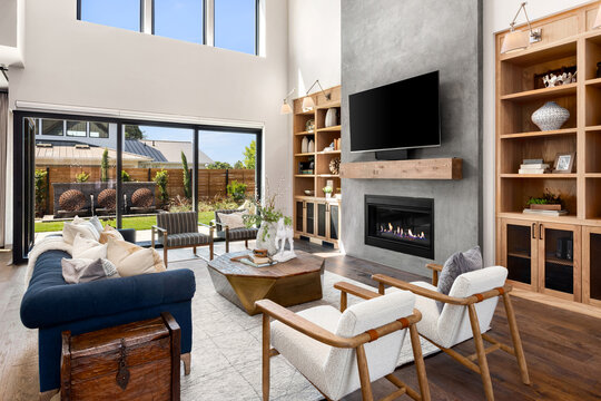 Living room in new luxury home with floor to ceiling fireplace