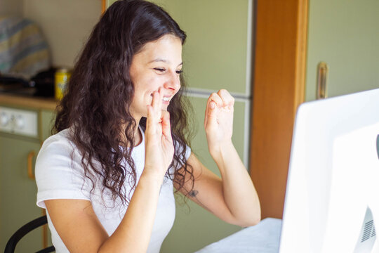 girl speaking sign language on video call