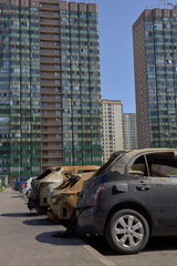 city burned cars after a fire in one of the city's districts