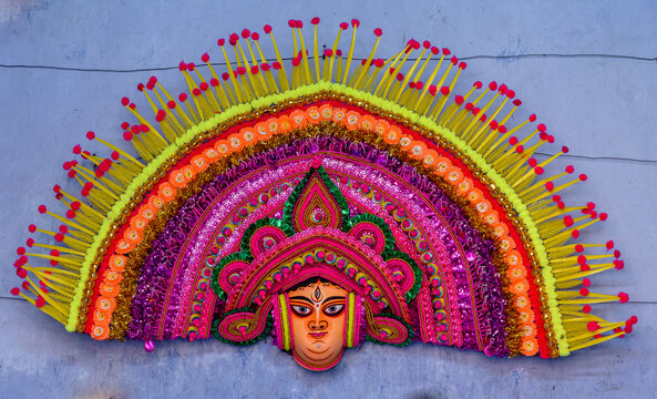 A Big Size Chhau Mask of Goddess Durga is displayed on the wall.