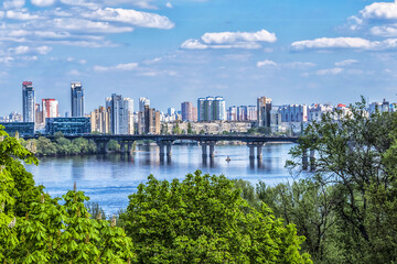 View of Dnieper River with Paton Bridge and architecture of Left Bank of Dnieper in Kyiv. Kyiv,...