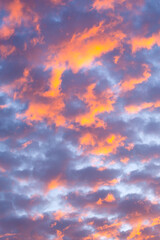 Beautiful clouds at sunset of orange and shades of blue