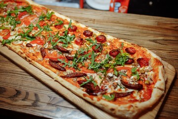 Pizza on wooden table top view. Fast food. Post blog social media. with copy space. Pizza ready to eat