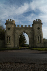 A portrait orientation of a symmetrical castle fort gateway or entrance. Positioned straight onto camera
