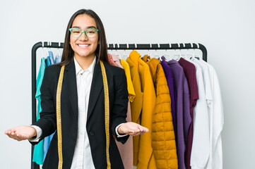 Young asian designer woman isolated on white background showing a welcome expression.