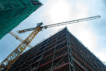 Construction site jib crane. Construction of new modern buildings. Urban architecture