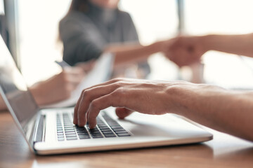 close up. businessman works on a laptop while sitting at an office Desk .