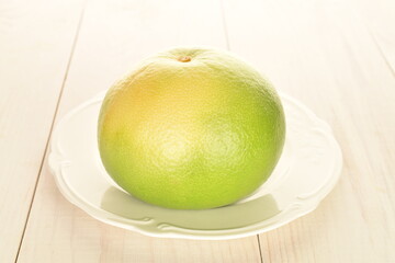 Ripe juicy sweets, close-up, on a white wooden table.