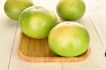 Ripe juicy sweets, close-up, on a white wooden table.