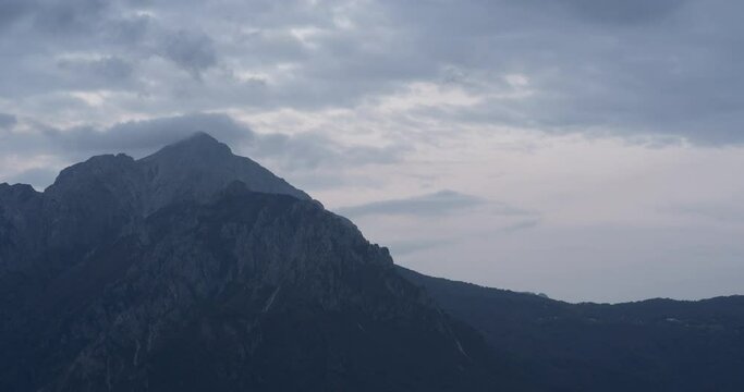 Mountain Grignetta with clouds in time lapse at sunset