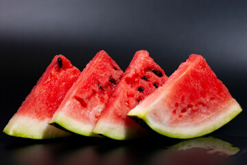 Watermelon slices are arranged in a row. There's an inscription at the bottom.