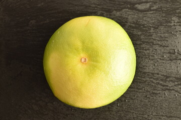 Ripe juicy sweets, close-up, on a slate board.