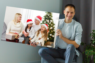man holds photo canvas at home
