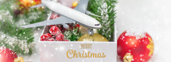 Travel for Christmas. Airplane with Christmas decor. Selective focus.