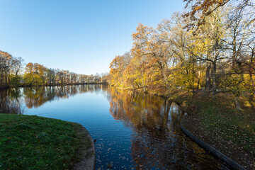 River flows through the park in mid-autumn in Russia.