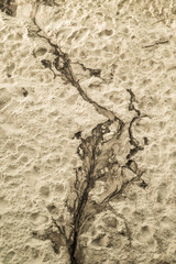 Top view of the sandy beach. Abstraction on the beach.