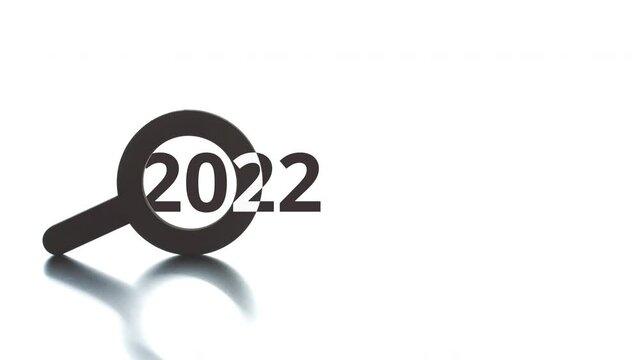 2022 text pops up from the magnifying glass icon, conceptal clip