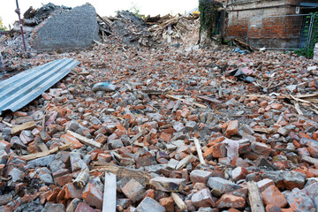 Dismantled building. A mountain of bricks. Destruction of buildings