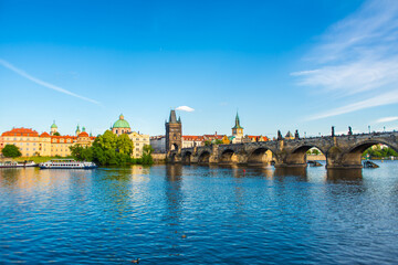 Obraz premium Summer landscape of Prague view of the Ltava river and the famous Charles bridge