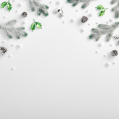 Evergreen tree branch with snow and pine cones. Square composition, flat lay, top view. Snow forest...