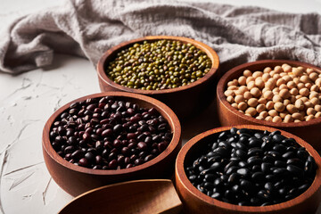 top view different whole grains beans on bowl white background.