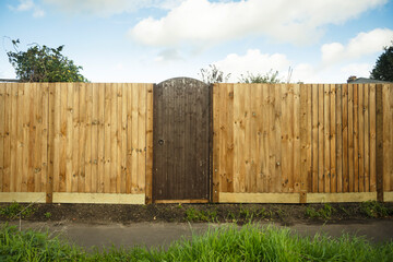 Fototapeta premium Gate in a wooden feather edge fence