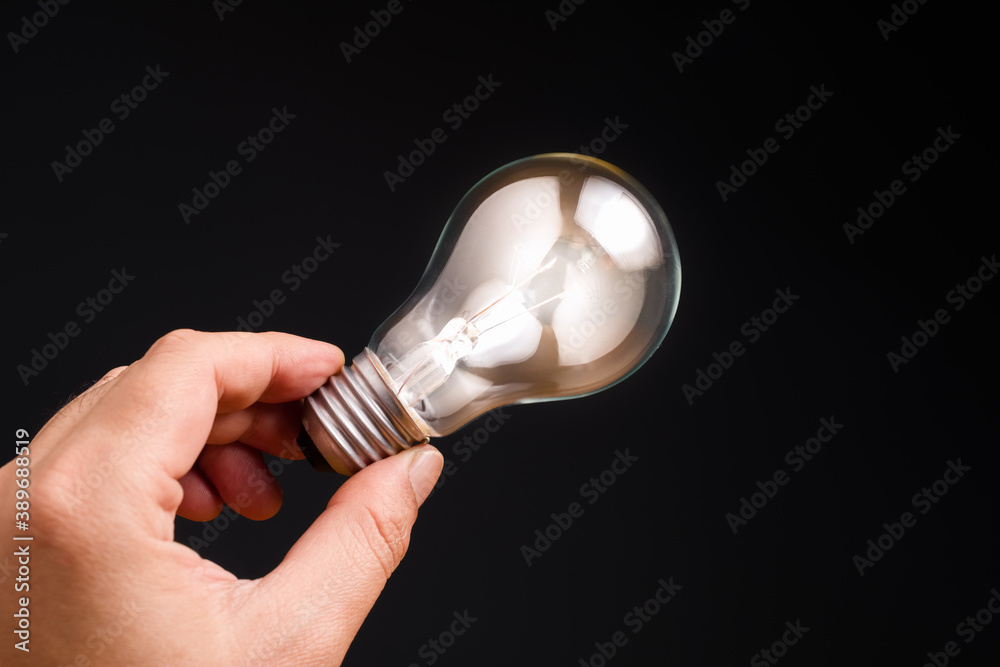 Canvas Prints Hand Show Glowing Light Bulb