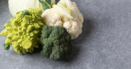 cabbage on gray background. Different varieties of cabbage for vegetable diet. Healthy food...