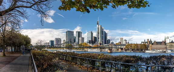 panorama of the Frankfurt  Germany skyline on a autumn day along the banks of the river Main  - obrazy, fototapety, plakaty
