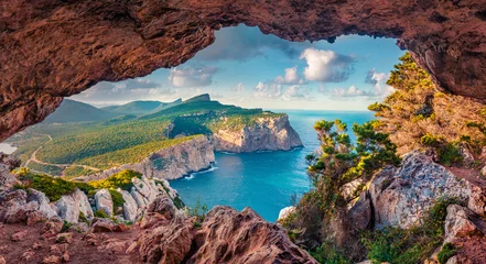 Fotobehang Astonishing summer view of Caccia cape from the small cave in the cliff. Fabulous morning scene of Sardinia island, Italy, Europe. Aerial Mediterranean seascape. Beauty of nature concept background. © Andrew Mayovskyy