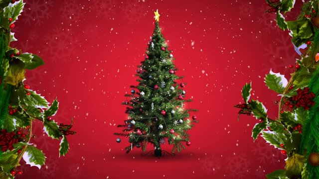 Animation of multiple snowflakes falling and christmas tree with holly branches on red background