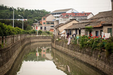 Fototapeta na wymiar narrow river in a small asian city