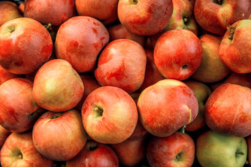 Fresh ripe red apples in the background