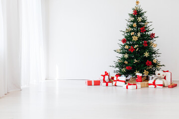 Christmas tree pine with gifts for the new year decor interior red white
