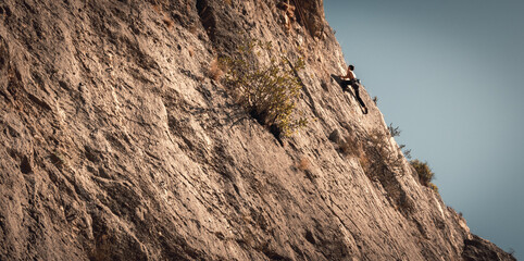 Climbers group, climbing the wall of a mountain