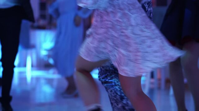 young woman in a short skirt dancing at a disco. sexy dance.
