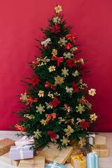 decor garland Christmas tree with gifts for the new year interior