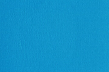 A blue vintage rough sheet of carton. Recycled environmentally friendly cardboard paper texture. Simple minimalist papercraft background.
