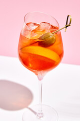 Aperol spritz on pink background
