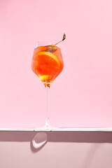 Aperol spritz on pink background