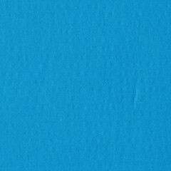 Fototapeta na wymiar A blue vintage rough sheet of carton. Recycled environmentally friendly cardboard paper texture. Simple minimalist papercraft background.