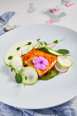 Salmon fillet with zucchini and cream of broccoli