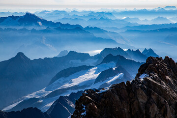 Endless swiss peaks from the summit of a mountain