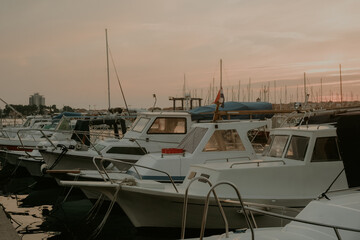 Fototapeta premium There are many yachts, boats and ships at sea. Marina at sunset.