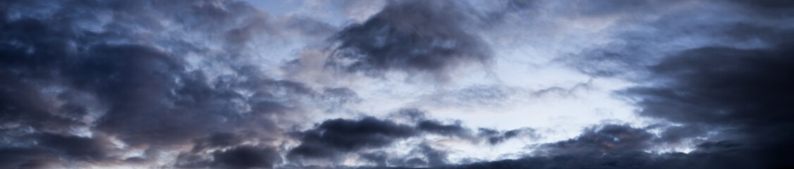 Background cloudscape great sky panorama with dark clouds showing a weather change