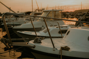 Fototapeta premium There are many yachts, boats and ships at sea. Marina at sunset.
